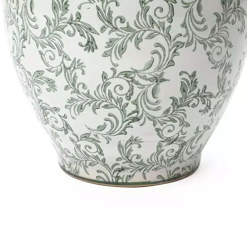 Pot de fleurs en céramique vert à motifs, rond, adapté à une utilisation intérieure et extérieure.