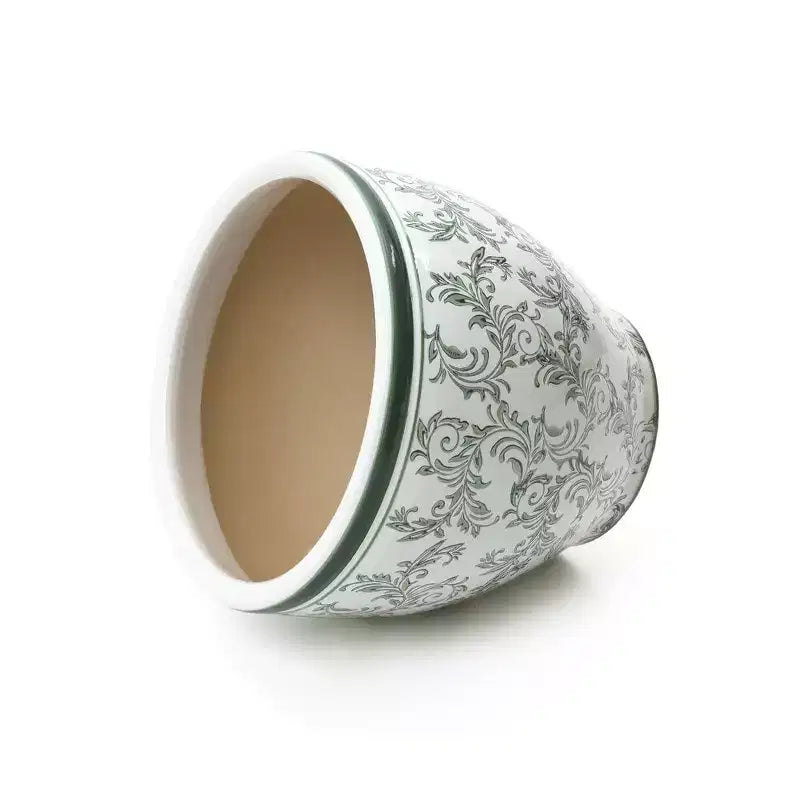 Pot de fleurs en céramique vert à motifs, rond, adapté à une utilisation intérieure et extérieure.
