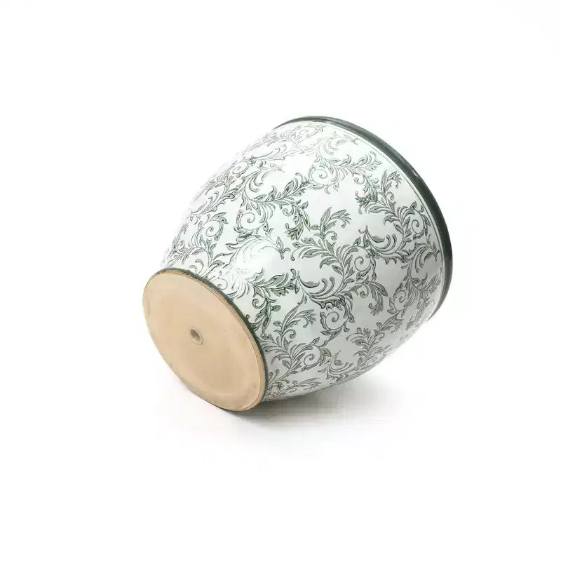 Pot de fleurs en céramique vert à motifs, rond, adapté à une utilisation intérieure et extérieure.
