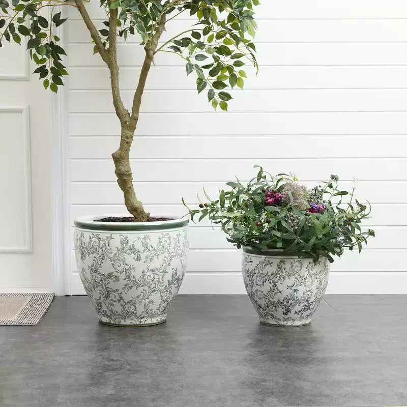 Pot de fleurs en céramique vert à motifs, rond, adapté à une utilisation intérieure et extérieure.